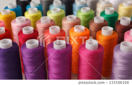 Set of colorful spools of thread 133586108