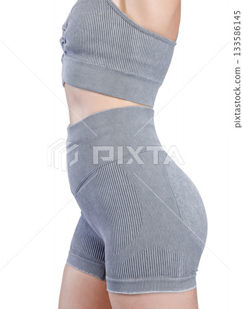 Sports jacket of grey color, women's sports suit seamless, jacket for yoga training on a girl on an isolated white background 133586145