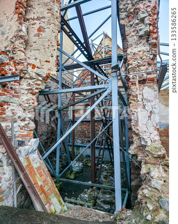 Historic brick ruins with exposed steel supports during preservation work in Riga, Latvia 133586265