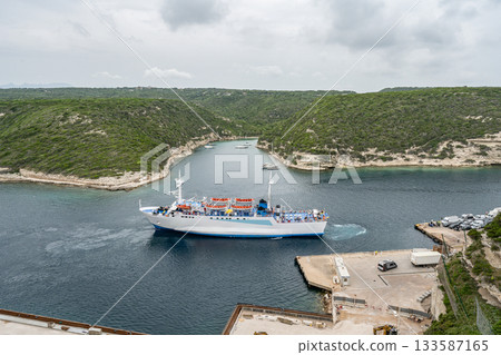 Aerial view marina cape Bonifacio south Corsica France citadel on rocky promontory on wild white limestone cliffs 133587165