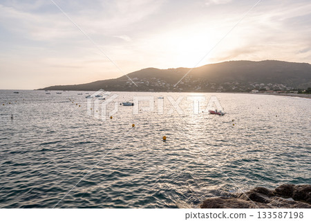Spectacular view Golf at Sagone Corsica France beautyful sand Beach boats mountain village Tourism and vacations concept 133587198