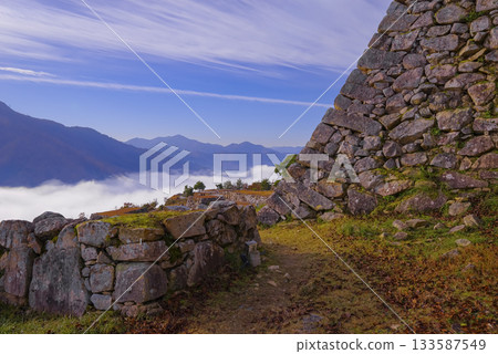 A magnificent sea of clouds enveloping the Takeda Castle ruins and a spectacular autumn view A magnificent sea of clouds enveloping the Takeda Castle ruins and a spectacular autumn view 133587549
