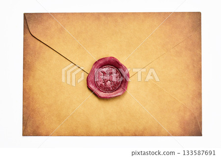 Sealed Vintage Envelope. A brown vintage envelope sealed with a red wax stamp featuring an intricate design. Sealed Vintage Envelope. A brown vintage envelope sealed with a red wax stamp featuring an intricate design. 133587691