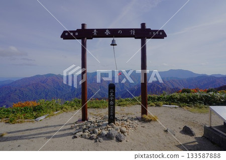 The summit marker and the Bell of Youth on Mt. Nioji The summit marker and the Bell of Youth on Mt. Nioji 133587888