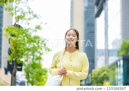 A young lady walking in the city A young lady walking in the city 133588567