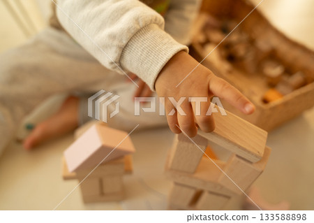 Building blocks and small child's hands Building blocks and small child's hands 133588898