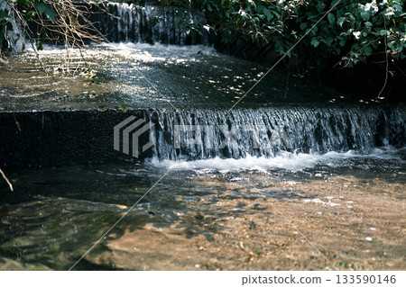 Gentle artificial waterfall 133590146