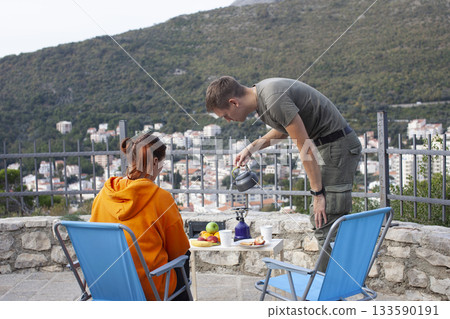 young couple going on the picnic on the top of the mountain, lifestyle people concept 133590191