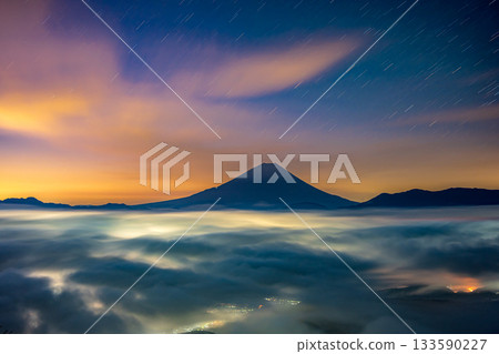 A sea of clouds floating in the twilight morning sky, Mount Fuji, and the town lights A sea of clouds floating in the twilight morning sky, Mount Fuji, and the town lights 133590227