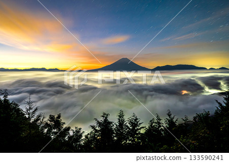 Mount Fuji and the sea of clouds at dawn as seen from the forest road on Mount Kushigatake Mount Fuji and the sea of clouds at dawn as seen from the forest road on Mount Kushigatake 133590241