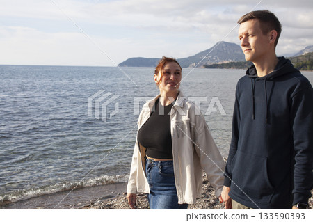 young caucasian couple tourists having fun on sea side, lifestyle people concept young caucasian couple tourists having fun on sea side, lifestyle people concept 133590393