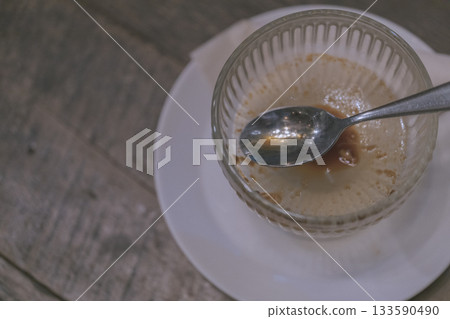 Finished dessert bowl and spoon Pudding Finished dessert bowl and spoon Pudding 133590490