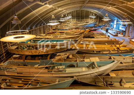 Toba City, Mie Prefecture - The interior of the ship building, which is the storage facility of the Maritime Museum, is filled with wooden ships. 133590690