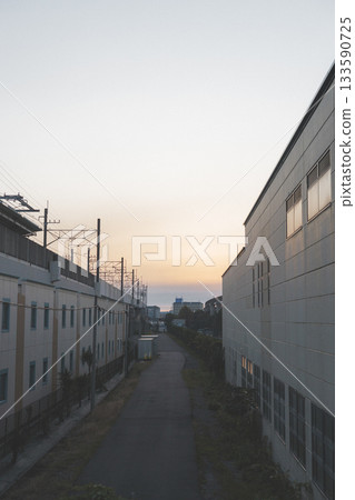 Morning view of the back alley next to the elevated railway near Maihama Station Morning view of the back alley next to the elevated railway near Maihama Station 133590725
