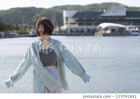 Woman looking at the sea Woman looking at the sea 133591841