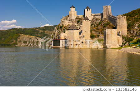 Nine tall towers of Golubac fortress are interconnected by wide stone walls. Nine tall towers of Golubac fortress are interconnected by wide stone walls. 133592146