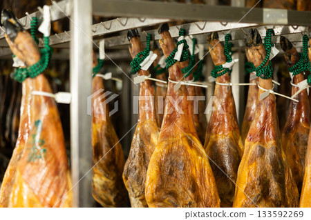 Legs of Spanish jamon ready for sale in grocery Legs of Spanish jamon ready for sale in grocery 133592269