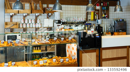 Warm bakery scene with fresh bread and pastries 133592496