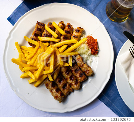 Grilled chevapcici sausages are made from minced meat mix Grilled chevapcici sausages are made from minced meat mix 133592673