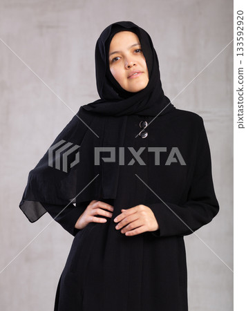 Young eastern girl laughing looking at camera studio shot 133592920