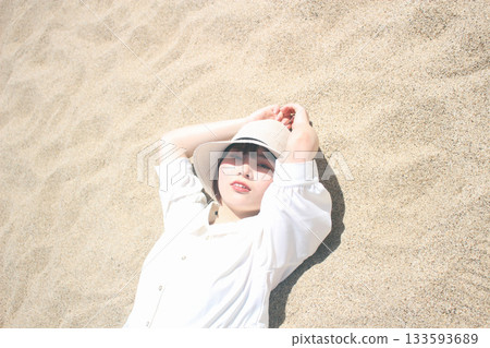 Woman lying in the sun Woman lying in the sun 133593689