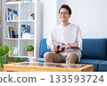 Man playing the ukulele 133593724
