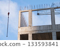 Concrete Wall Frame of Building under Construction. Formwork Prints on Surface with Fittings Release from Monolithic box at Construction Site. Red Hook of Tower Crane next to Architectural Structure. 133593841