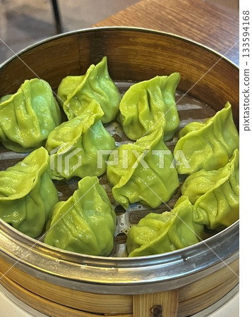 Korean dumplings filled with a mix of savory ingredients like ground meat, tofu, and vegetables. Mandu can be steamed, boiled, or pan-fried, making it a versatile and delicious snack or meal. Korean dumplings filled with a mix of savory ingredients like ground meat, tofu, and vegetables. Mandu can be steamed, boiled, or pan-fried, making it a versatile and delicious snack or meal. 133594168