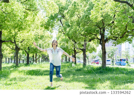 Woman relaxing in the forest Woman relaxing in the forest 133594262