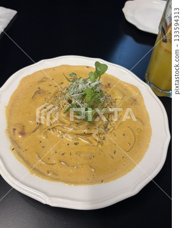 Creamy and rich spaghetti coated in a luscious white sauce, offering a smooth and savory flavor perfect for a comforting and satisfying meal. Creamy and rich spaghetti coated in a luscious white sauce, offering a smooth and savory flavor perfect for a comforting and satisfying meal. 133594313