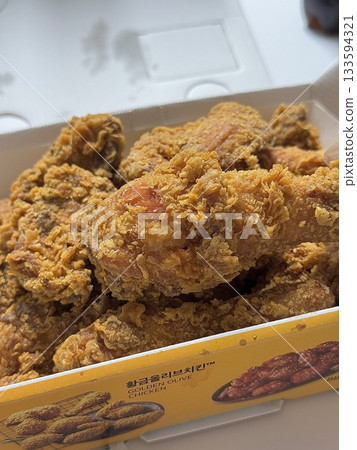 Crispy Korean fried chicken, perfectly glazed with a sweet and spicy sauce. Ideal for food photography and menus, showcasing the irresistible crunch and flavor of this beloved dish. Crispy Korean fried chicken, perfectly glazed with a sweet and spicy sauce. Ideal for food photography and menus, showcasing the irresistible crunch and flavor of this beloved dish. 133594321