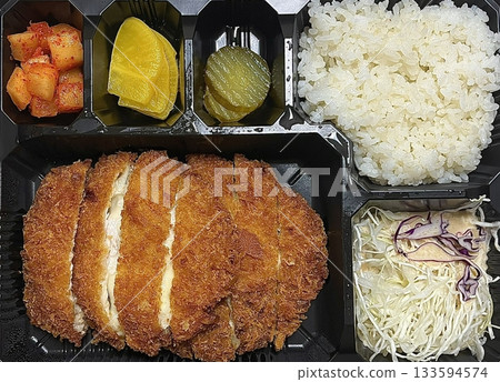 Crispy tonkatsu cutlet stuffed with melted cheese, creating a savory blend of crunch and creaminess. A comforting and satisfying dish with a rich, golden finish. Crispy tonkatsu cutlet stuffed with melted cheese, creating a savory blend of crunch and creaminess. A comforting and satisfying dish with a rich, golden finish. 133594574