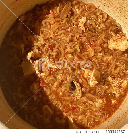Shin Ramyun,close up of Ramyeon or Ramyun is a Korean-style soup noodle dish with a spicy flavor. Ramyeon or Korean instant noodles with egg - Korean food style Shin Ramyun,close up of Ramyeon or Ramyun is a Korean-style soup noodle dish with a spicy flavor. Ramyeon or Korean instant noodles with egg - Korean food style 133594587