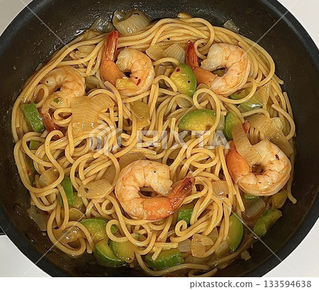 Gambas spaghetti with succulent shrimp, garlic, olive oil, and chili flakes—a perfect fusion of seafood richness and Italian flavor in every bite. Gambas spaghetti with succulent shrimp, garlic, olive oil, and chili flakes—a perfect fusion of seafood richness and Italian flavor in every bite. 133594638