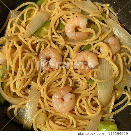 Gambas spaghetti with succulent shrimp, garlic, olive oil, and chili flakes—a perfect fusion of seafood richness and Italian flavor in every bite. Gambas spaghetti with succulent shrimp, garlic, olive oil, and chili flakes—a perfect fusion of seafood richness and Italian flavor in every bite. 133594639