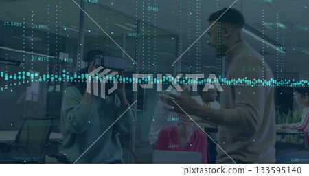 Testing woman wearing green sweater using VR headset at conference table, with data overlay Testing woman wearing green sweater using VR headset at conference table, with data overlay 133595140