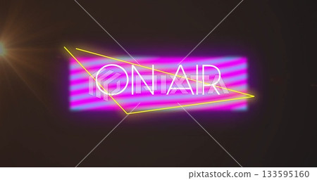 Glowing neon 'ON AIR' sign shining in dark studio, purple-pink panel, yellow lines, warm lens flare 133595160
