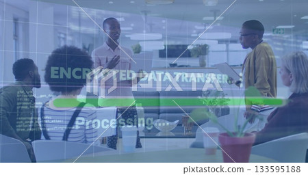 Discussing team in work attire at table in open-plan office with tablets and encrypted overlay 133595188