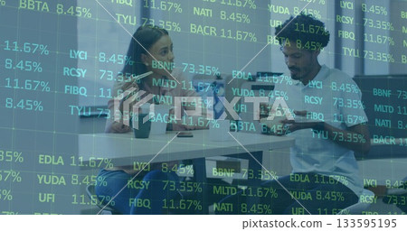 Reviewing digital stock data, two colleagues using smartphone and tablet in meeting room with mugs Reviewing digital stock data, two colleagues using smartphone and tablet in meeting room with mugs 133595195