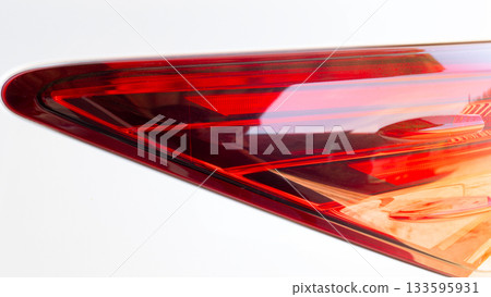 Close up of traillgith of white car. Bright and luxurious lamp cover. 133595931