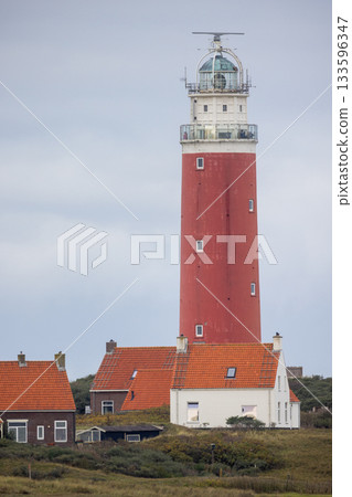 Eierland, De Cocksdorp, Texel, The Netherlands, Oktober 28th, 2024, The Iconic Red Lighthouse stands Eierland, De Cocksdorp, Texel, The Netherlands, Oktober 28th, 2024, The Iconic Red Lighthouse stands 133596347