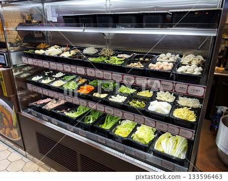 Vegetables lined up on shelves at a malatang shop Vegetables lined up on shelves at a malatang shop 133596463