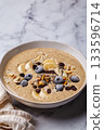 Chocolate smoothie bowl with banana, blueberries and nuts. 133596714