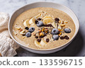 Chocolate smoothie bowl with banana, blueberries and nuts. 133596715