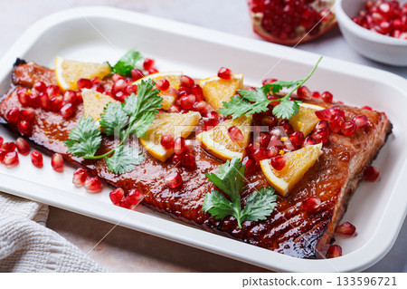Christmas salmon in pomegranate juice with orange and pomegranate seeds. 133596721