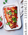 Christmas salmon in pomegranate juice with orange and pomegranate seeds. 133596723