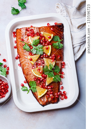 Christmas salmon in pomegranate juice with orange and pomegranate seeds. Christmas salmon in pomegranate juice with orange and pomegranate seeds. 133596723