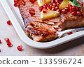 Christmas salmon in pomegranate juice with orange and pomegranate seeds. 133596724