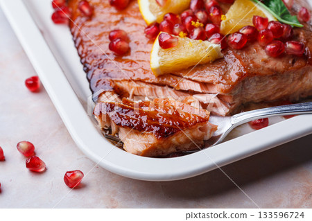Christmas salmon in pomegranate juice with orange and pomegranate seeds. Christmas salmon in pomegranate juice with orange and pomegranate seeds. 133596724
