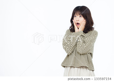 Surprised and amazed woman 133597154